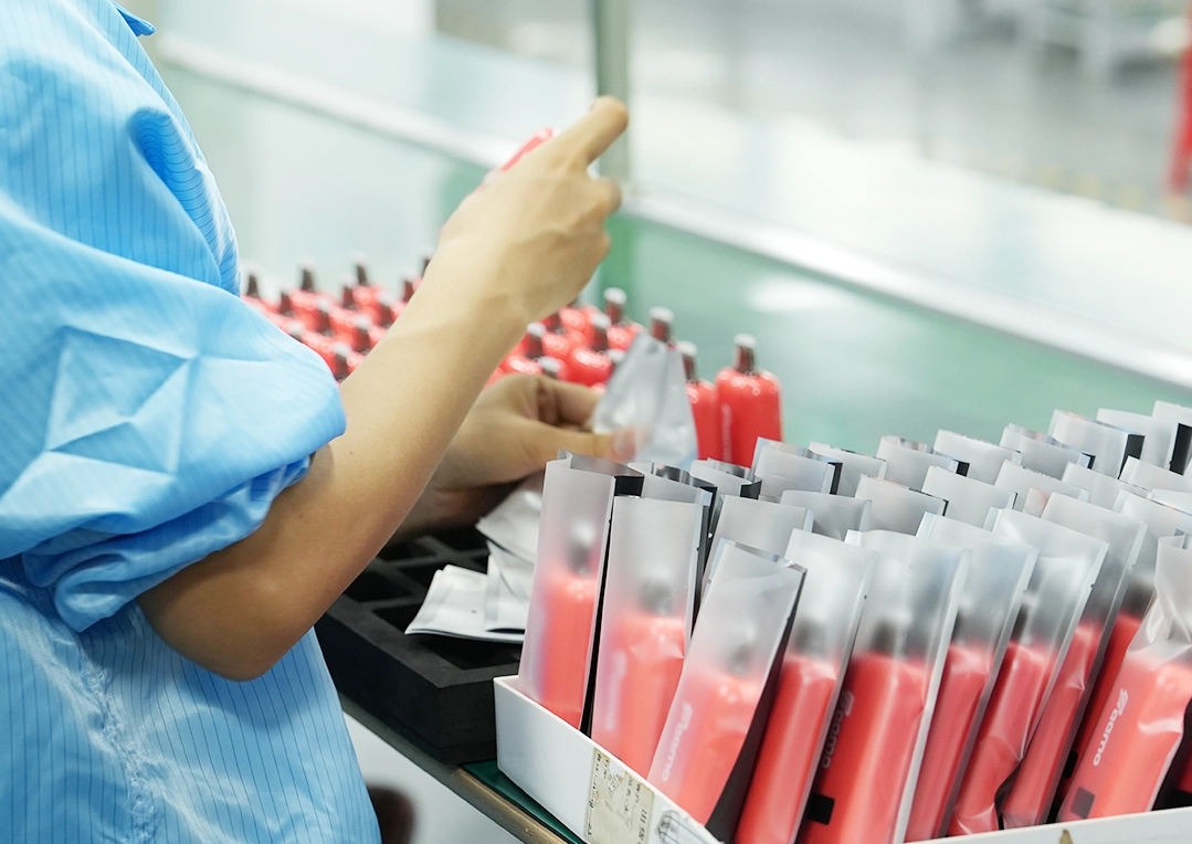 Factory worker handling vape products